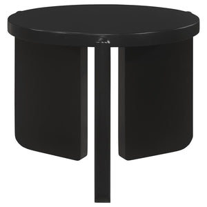 Nestled quietly by your sofa, this end table exudes a contemporary calm, its round shape a soft counterpoint to the angular lines of modern interiors. Solid wood bends and curves in a display of craftsmanship, presenting a substantial yet refined presence