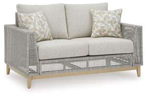 This loveseat invites your casual contemporary style outdoors. With its resin wicker in a chic neutral hue, it expertly marries refined design with durability. Breezy summer mornings and cold winter nights are made all the more comfortable with high-perfo