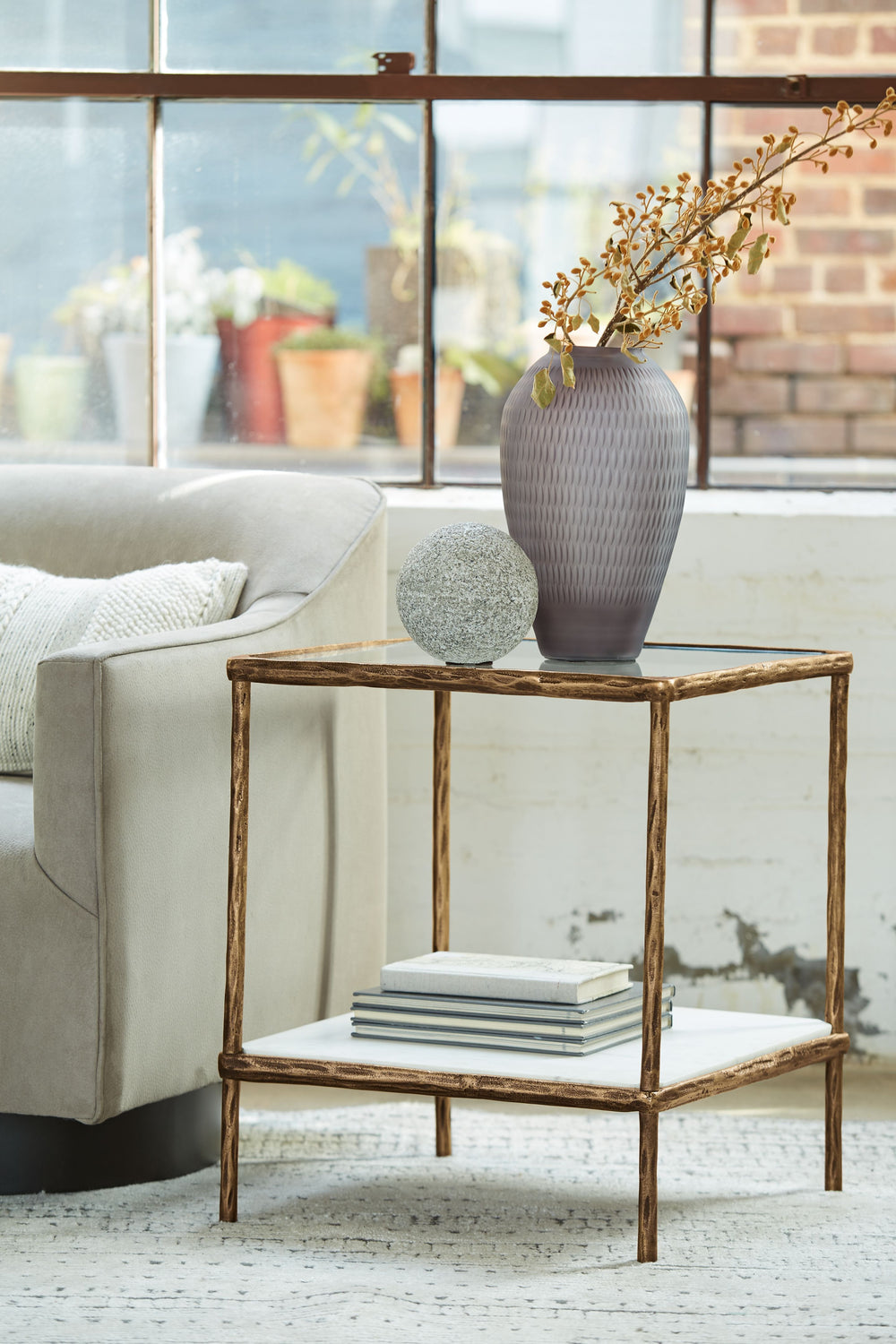 Classic in design with a dash of textural appeal, this accent table provides both flair and function. The glass tabletop offers the perfect perch for a lamp, while the white marble lower shelf is ideal for resting trendy coffee table books and other decor