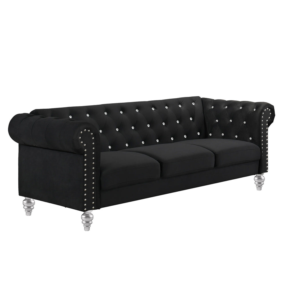 The New Classic Emma Chesterfield Velvet 3 Seat Sofa is a blend of soft elegance and sophisticated design. Crafted from 100% polyester velvet fabric, it offers cozy and indulgent seating for three. The glam tailoring features tufted backs and arms adorned
