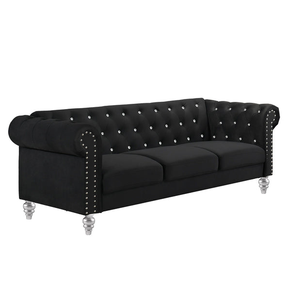 The New Classic Emma Chesterfield Velvet 3 Seat Sofa is a blend of soft elegance and sophisticated design. Crafted from 100% polyester velvet fabric, it offers cozy and indulgent seating for three. The glam tailoring features tufted backs and arms adorned