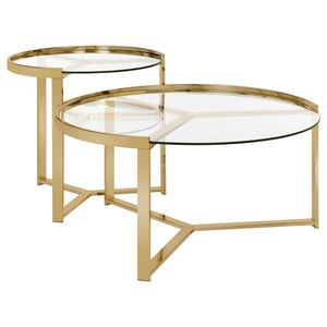 Embrace the elegance of this nesting coffee table set, where sleek round clear tempered glass tops rest gracefully atop a shimmering gold electroplated metal base. The modern, refined design captures a perfect balance of beauty and function, creating an e