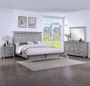 This bedroom suite offers a refreshing take on rustic charm, featuring a soft greige finish that highlights the natural wood grain. The sturdy bed stands as the centerpiece with its robust headboard and inviting design, while the accompanying pieces â€” a