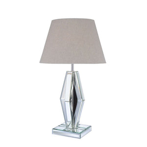 Create a luxurious space with this stunning faceted diamond crystal table lamp. This Britt table lamp is topped with a light brown fabric barrel shade and mirrored base. Featuring in LED light bulb and rocker switch on power cable, the clear finish expose