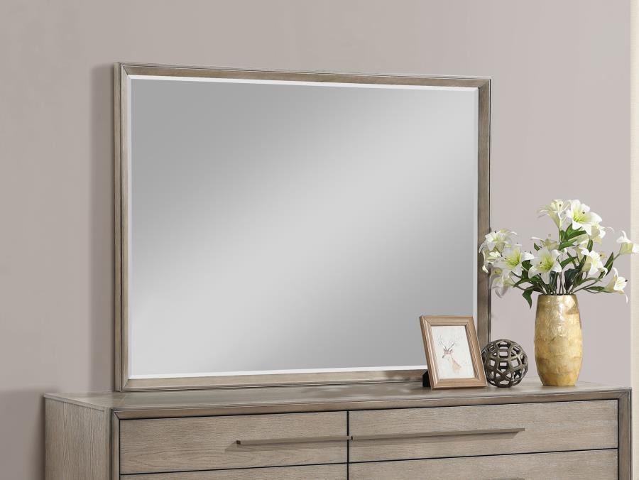 This framed dresser mirror adds a touch of modern sophistication to your bedroom. The Taupe oak finish complements a variety of decor styles, providing a neutral yet stylish accent. Its clean-lined frame echoes the mitered trim of the dresser, creating a 
