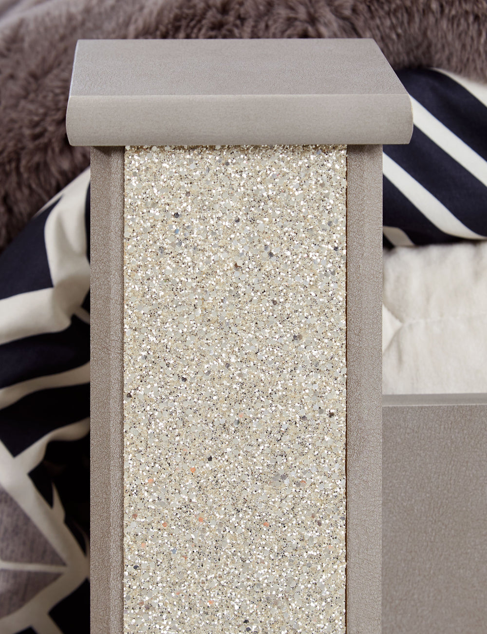 Love sleek and bold contemporary style? Drink in the beauty of this king poster bed. The piece-'s eye-catching details include a leather grain look, glam glitter accents and remote-controlled LED lighting. Combined with the streamlined aesthetic, it-'s a 