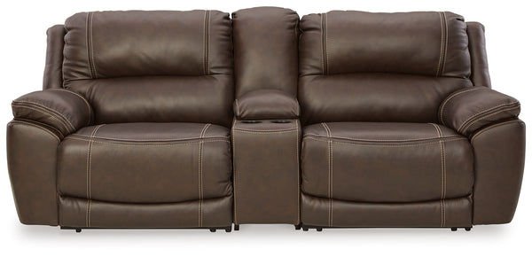 Load up on comfort in a cool, clean-lined and contemporary way with this power reclining loveseat with console in chocolate brown. Rest assured, the expertly matched leather and faux leather upholstery is enriched with a pebble grain effect for authentic 