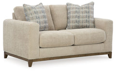 Serene style with a modern sensibility. Delight in the cozy, versatile embrace of this loveseat. It takes an on-trend approach to irresistible texture and natural beauty, showcasing soft upholstery accented with a transitional wood trim. As refined as it 