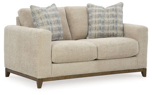Serene style with a modern sensibility. Delight in the cozy, versatile embrace of this loveseat. It takes an on-trend approach to irresistible texture and natural beauty, showcasing soft upholstery accented with a transitional wood trim. As refined as it 