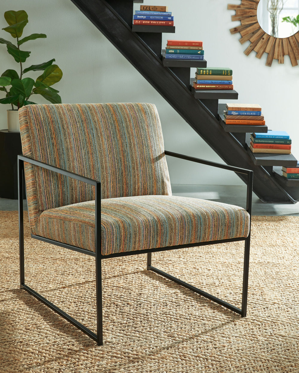 Dress up your reading nook or den with the decidedly contemporary stylings of this accent chair. Multicolored striped upholstery provides a pop of pattern while remaining reserved and refined in appearance. A streamlined metal frame polishes off the posh 