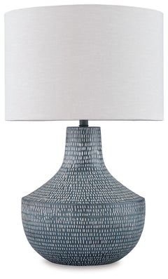 Enhance your decor with a touch of captivating texture. This table lamp features a beautifully crafted body made of hammered metal with an antiqued finish. Topped with a crisp off-white fabric shade, it illuminates a casual vibe with soft, diffused light.