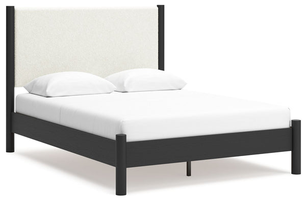 This queen upholstered panel bed reflects your sophisticated approach to boho style. Crafted with both form and function in mind, its fresh white fabric beautifully contrasts the matte black finish. The versatile design suits all-neutral spaces or blends 