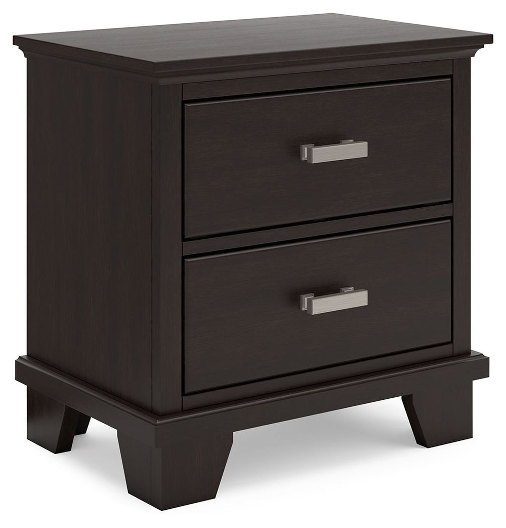 Feast your eyes on this richly versatile nightstand. Its traditional-inspired dark brown finish effortlessly blends with contemporary bright nickel-tone pulls to create a stunning look that-'s not too stuffy or too trendy. Spacious drawers offer plenty of