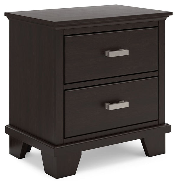 Feast your eyes on this richly versatile nightstand. Its traditional-inspired dark brown finish effortlessly blends with contemporary bright nickel-tone pulls to create a stunning look that-'s not too stuffy or too trendy. Spacious drawers offer plenty of