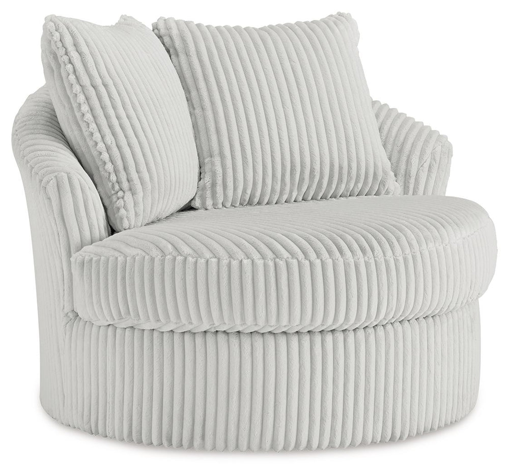 This swivel chair takes style and comfort full circle. Its plush, neutral corduroy upholstery is casually cool and beautifully on trend, while throw pillows elevate the cozy factor. A smooth-gliding 360-degree swivel lets you go with the flow. Come on, yo