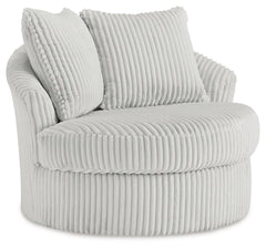This swivel chair takes style and comfort full circle. Its plush, neutral corduroy upholstery is casually cool and beautifully on trend, while throw pillows elevate the cozy factor. A smooth-gliding 360-degree swivel lets you go with the flow. Come on, yo