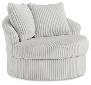 This swivel chair takes style and comfort full circle. Its plush, neutral corduroy upholstery is casually cool and beautifully on trend, while throw pillows elevate the cozy factor. A smooth-gliding 360-degree swivel lets you go with the flow. Come on, yo