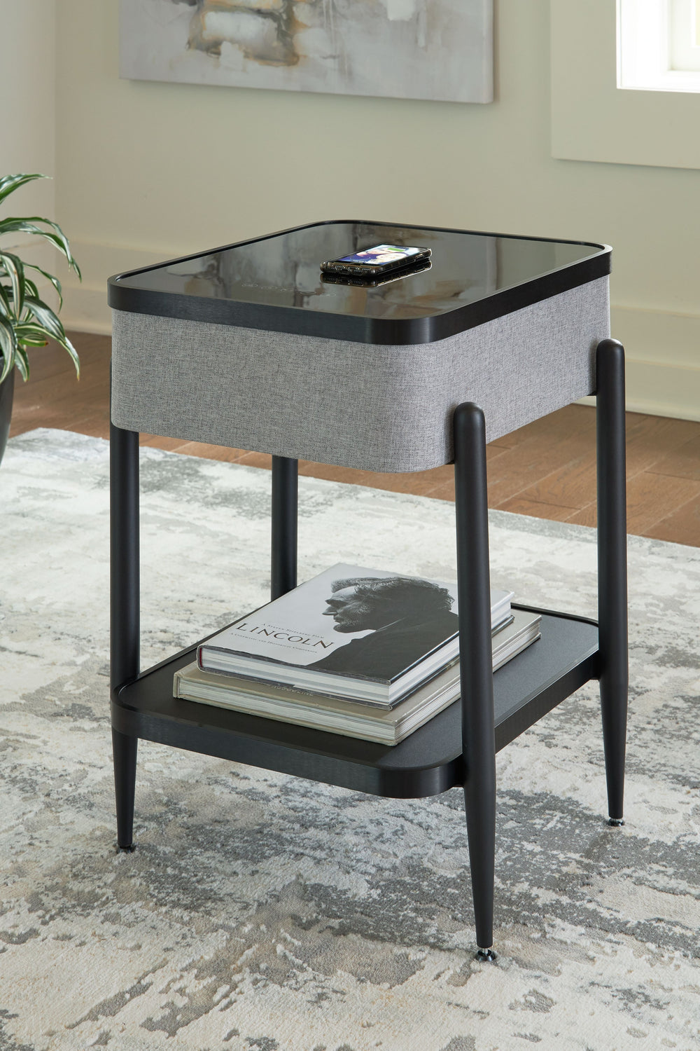 If you-'re a fan of sleek, space-saving design, this accent table will be music to your ears. In tune with your lifestyle, it features an integrated speaker that connects wirelessly to your favorite songs. Its glass top (with wireless charging and touch-b