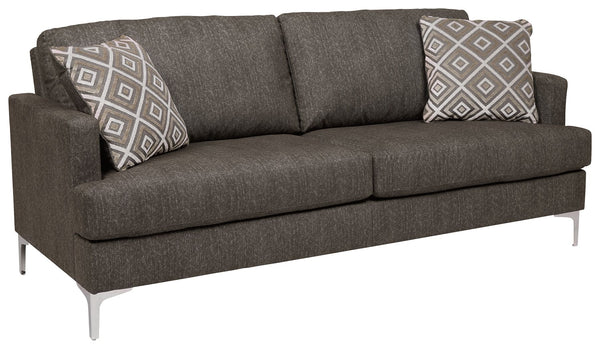  settle into the heavenly texture of this sofa. The tremendously soft upholstery has a slight herringbone pattern that adds depth and richness to the java color. The metal accent legs elevate this piece as well as the styl