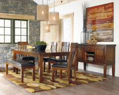 Made with select acacia veneers and hardwood solids. Gently distressed and burnished dark brown finish. D594-35 has a planked table design with thick-look tops and butterfly leaf. Seat covers in brown faux leather. Server features a working drawer along w