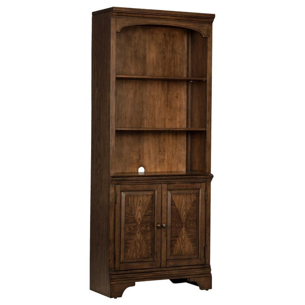 This traditional style bookcase is enhanced with beautiful molded detailing. Two bottom cabinet drawers offer concealed storage for small items. Three open shelves allow you to neatly organize your items. Molded accents on the frame and a curve at the top
