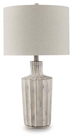 Exuding a casually cool sensibility, this table lamp is a bright idea whether itâ€™s in a living space, bedroom or entry. The shapely base sports a vertical line pattern with a distressed finish that enhances its relaxed appeal.<br><br><b>Additional Dimen