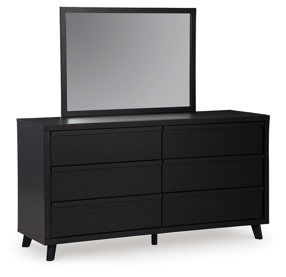 Sophisticated style for the savvy shopper. This dresser with mirror prioritizes affordable, on-trend design. Its subtle replicated texture recalls the natural beauty of wood, highlighting the slatted styling. And a matte black finish savvily suits differe
