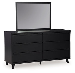 Sophisticated style for the savvy shopper. This dresser with mirror prioritizes affordable, on-trend design. Its subtle replicated texture recalls the natural beauty of wood, highlighting the slatted styling. And a matte black finish savvily suits differe