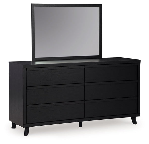 Sophisticated style for the savvy shopper. This dresser with mirror prioritizes affordable, on-trend design. Its subtle replicated texture recalls the natural beauty of wood, highlighting the slatted styling. And a matte black finish savvily suits differe