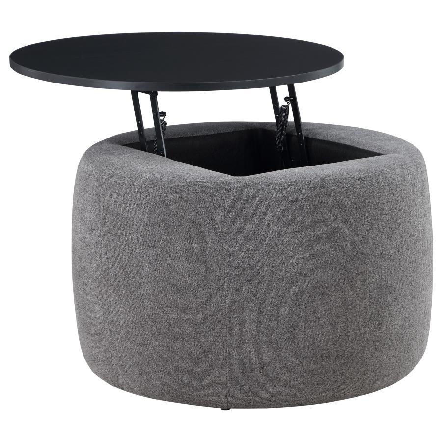 Indulge in the seamless blend of functionality and style with this chic round ottoman. Draped in sumptuously soft grey chenille, it invites relaxation while concealing a spacious storage compartment beneath its sleek black lift-top. Its subtle charm is el