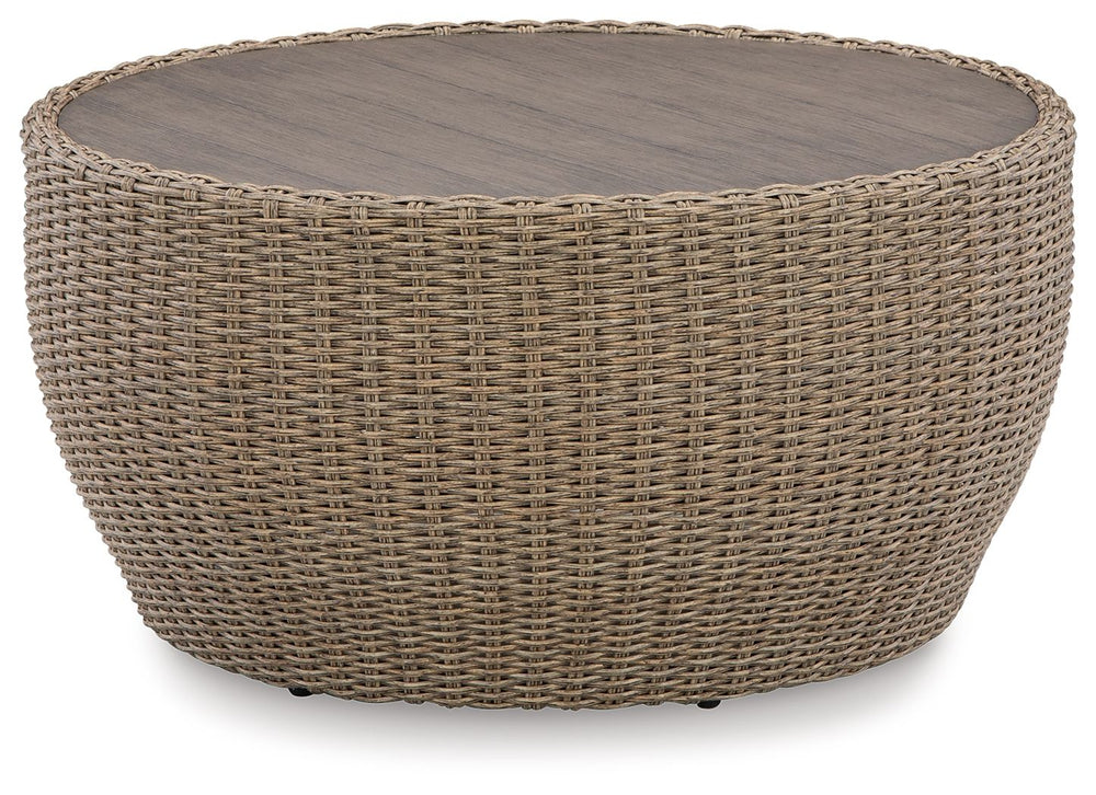 This coffee table completes your outdoor seating area with its fresh take on casual comfort. Handwoven resin wicker over a curving frame balances streamlined style and exceptional durability. An aluminum top polishes off the piece, acting as a perfect per
