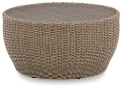 This coffee table completes your outdoor seating area with its fresh take on casual comfort. Handwoven resin wicker over a curving frame balances streamlined style and exceptional durability. An aluminum top polishes off the piece, acting as a perfect per