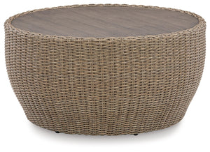 This coffee table completes your outdoor seating area with its fresh take on casual comfort. Handwoven resin wicker over a curving frame balances streamlined style and exceptional durability. An aluminum top polishes off the piece, acting as a perfect per