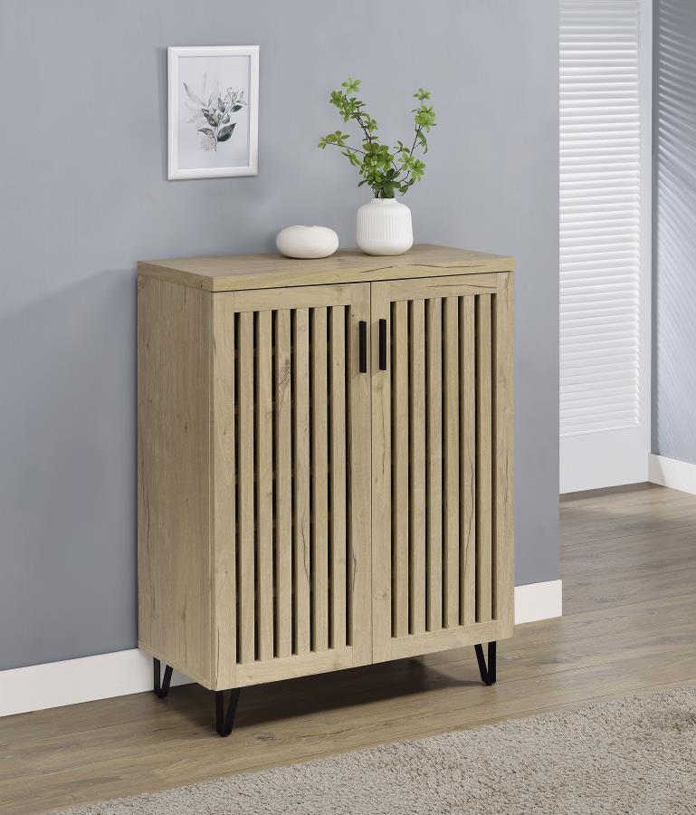 Transform your foyer or hallway with this versatile shoe cabinet, designed to keep your footwear organized and out of sight while complementing a variety of interior styles. Behind its distinctive vertical-slatted doors, multiple adjustable shelves provid