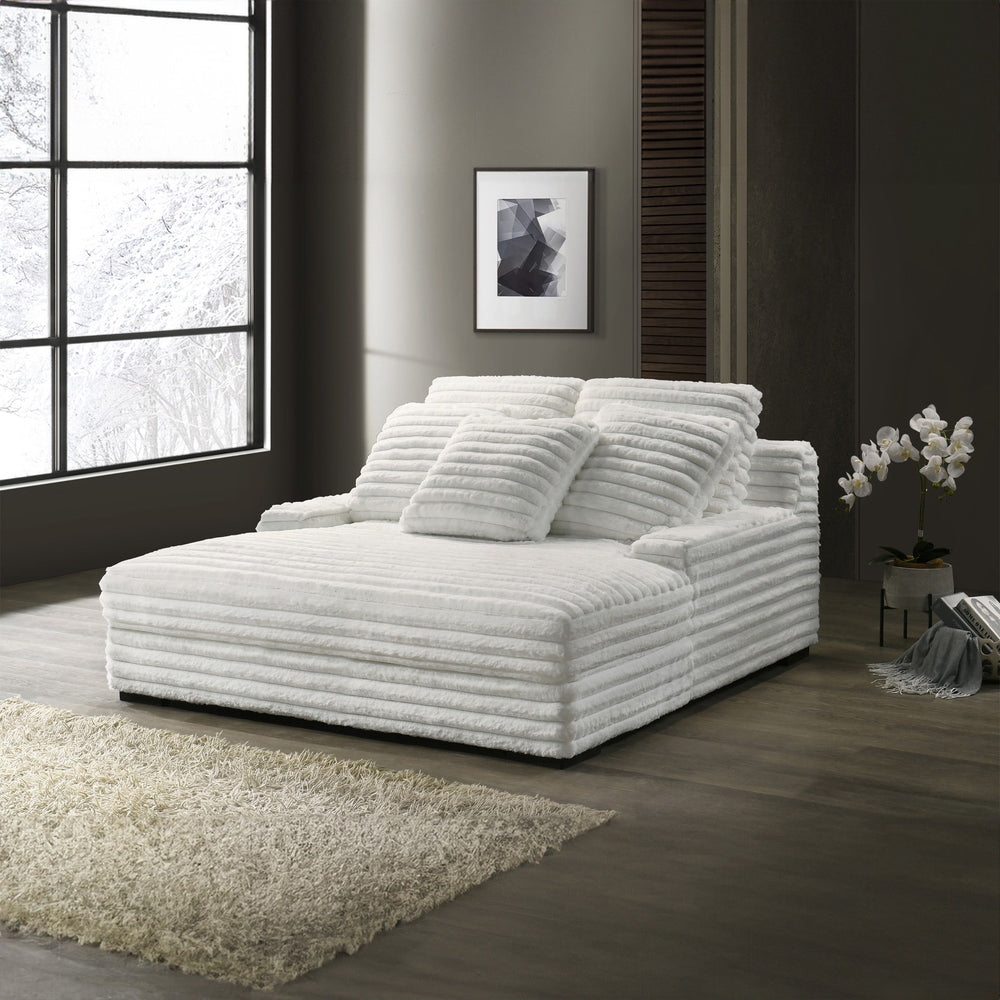 The Embrace Dual Chaise Lounge in white is a luxurious and versatile addition to your home, perfect for both lounging and accommodating guests. Featuring 100% white polyester fabric with a fluffy, blanket-like texture, this chaise lounge is designed for u