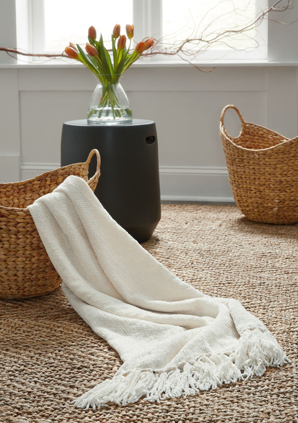  this cream throw blanket also makes a stylish statement. Whether draped over the arm of a sofa or folded at the foot of a bed