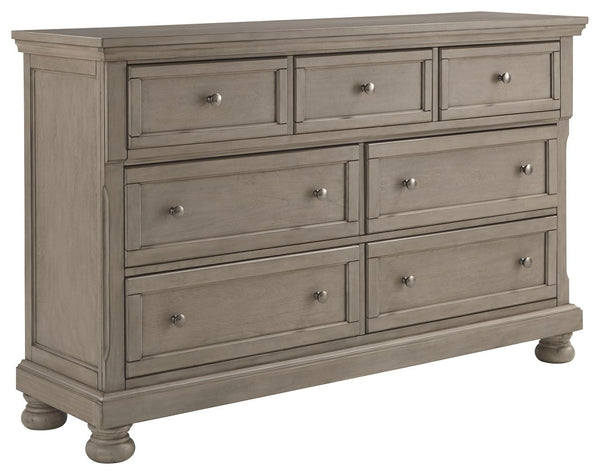 Satisfying your taste for tradition, this dresser sports serene sophistication. Forever classic design detailsâ€”inlaid panels, silvertone patina hardware and bun feetâ€”are so easy to love. A burnished light gray finish elevates the look with modern sens