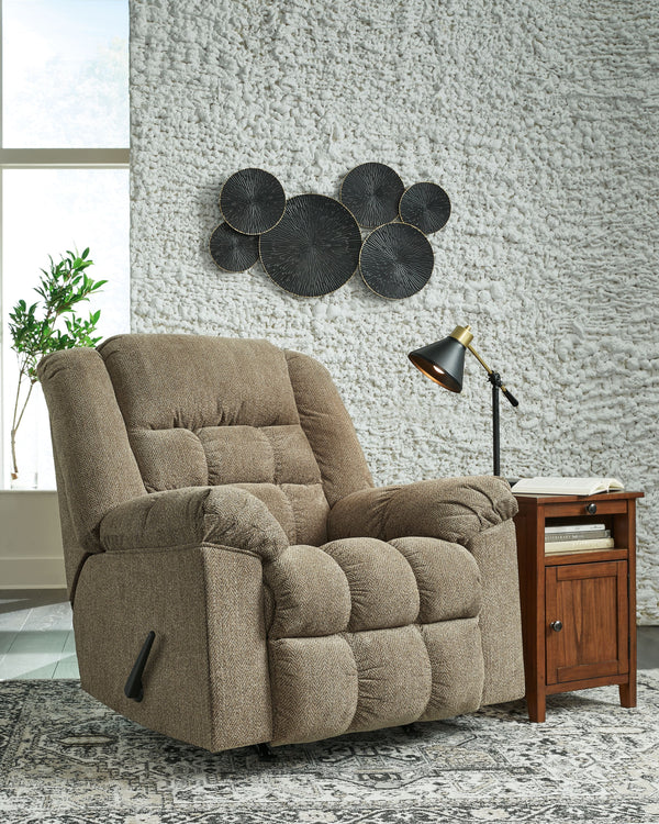  this rocker recliner-'s supremely plush seating lines you up for hours of leisure. Its one-pull reclining motion places you in optimal TV watching