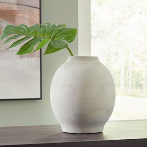 this vaseâ€™s trend-right sage green finish makes a chic impression. Ceramic craftsmanship gives it a timeless feel. What an artful addition to your tablescape