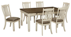 Unique two-tone finish with a combination of Oak and Acacia substrates combining a trendy textured antique white color with table and server tops finished in a textural weathered oak finish. Rectangular dining table features six convenient drawers for sto