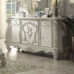 The Versailles dresser is the perfect accent to create the style of royalty your bedroom has been needing. This dresser crafted in wood with bone white finish was inspired by old European design with brown copper metal hardware and intricate wood carvings
