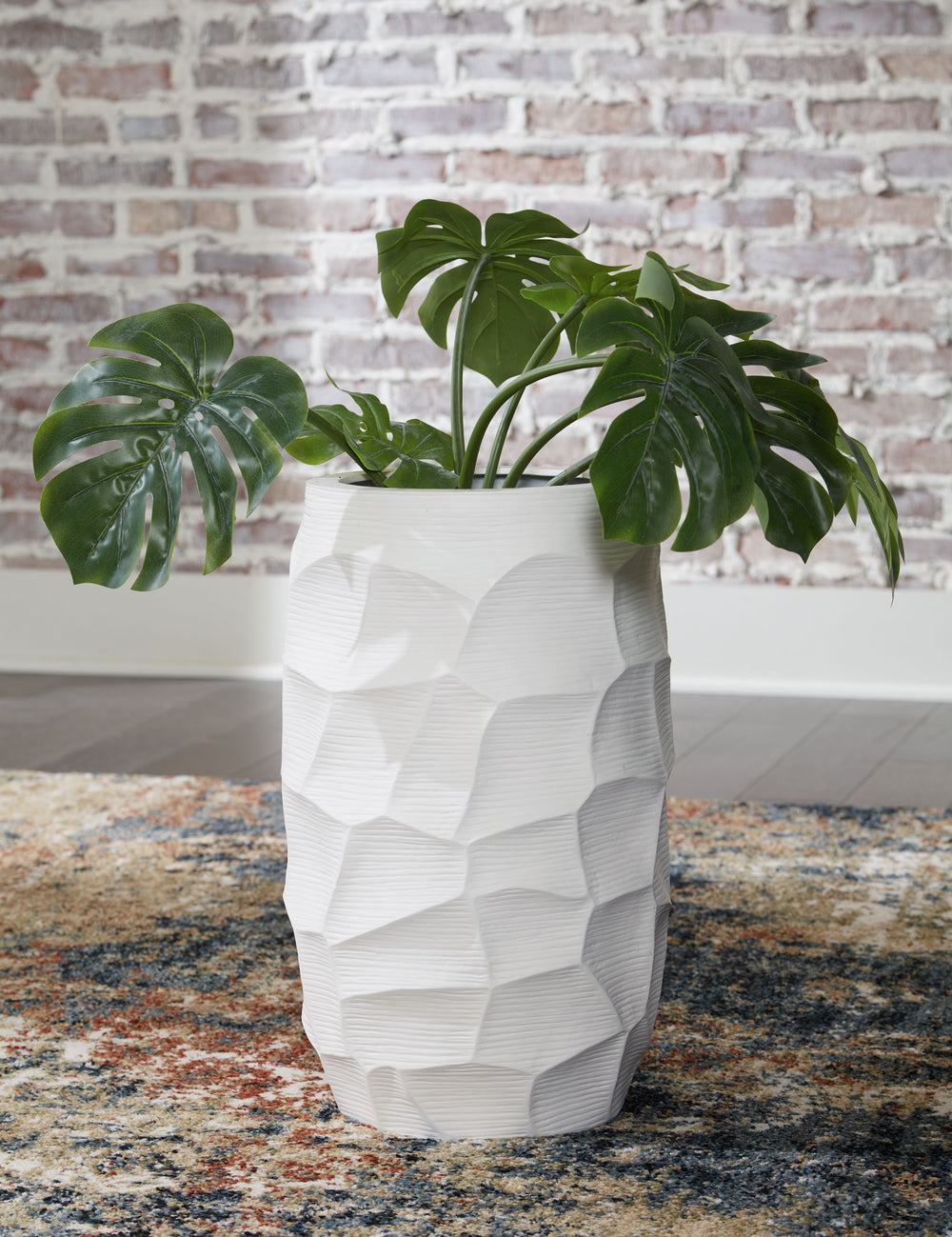 A contemporary take on texture. This vaseâ€™s sculptural details are made all the more beautiful with a crisp white finish. Itâ€™s stunning when displayed on its own, making an impression on accent tables and bookshelves. Want to change your decor with th