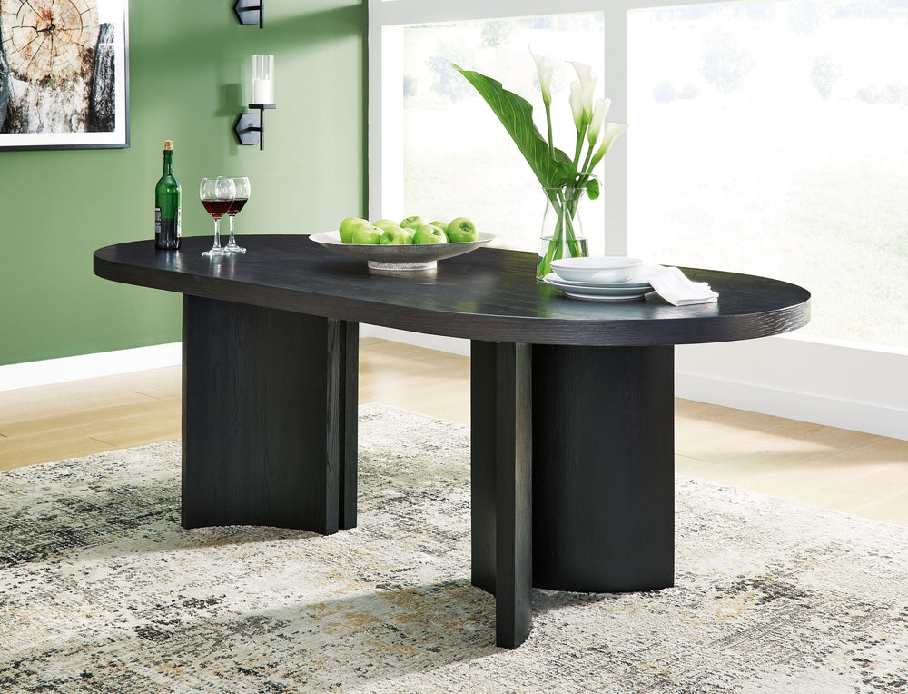 Contemporary lifestyle design. Made of hardwood solids and ash veneer. Rich layered black finish on textured wood grain surface. Collection is inspired by Art Deco designs with trend-right curved silhouettes. Table features an oval design and architectura