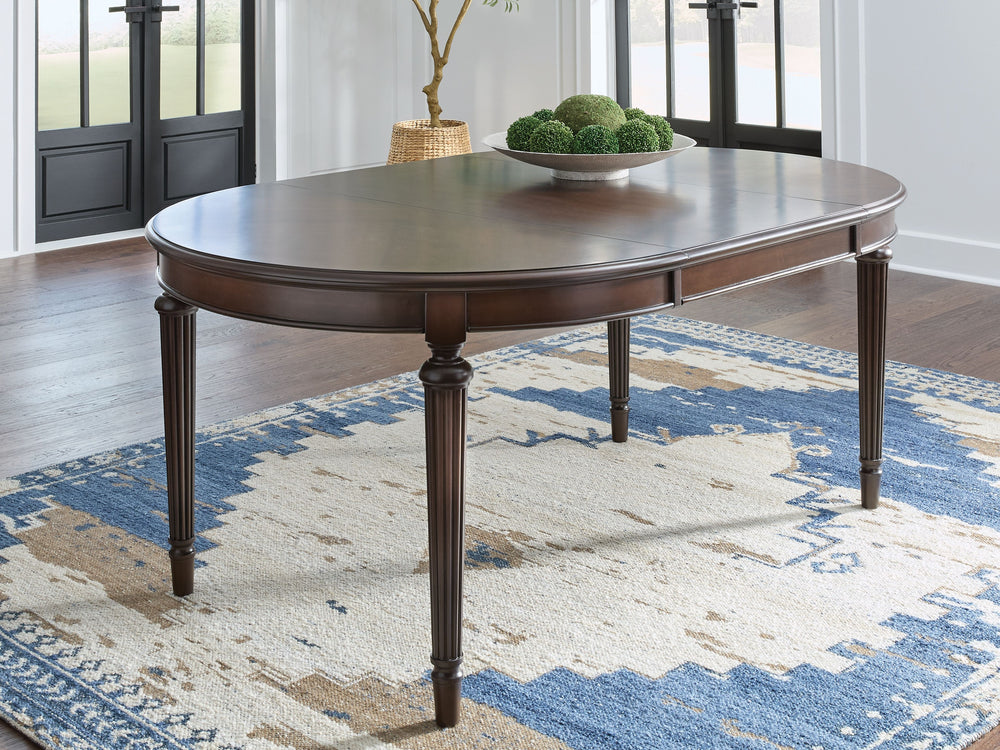 Serve up elegance and poise with this dining extension table. Its traditional silhouette is detailed with reeded legs for added opulence. A removable leaf effortlessly extends the table when guests drop in. From everyday meals to hosting family and friend