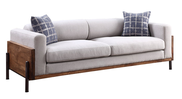 Our Acme exclusive Pelton sofa set will be the star of your living area. With deep, comfortable seats wrapped in a high shelter backrest in a beautiful walnut finish, this set also features metal legs that lend a lightness to each generously-sized piece. 