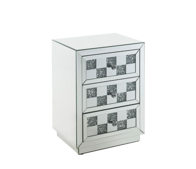 Bring life into your home with this dazzling Noralie Accent Table. With a glamorous mirrored finish, the table is accented by faux diamond inlays to impress all of your guests. The faux diamonds reflect a rainbow of colors throughout the room. The mirrore