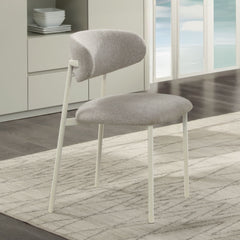The Ingram collection brings modern elegance to your home with its sophisticated pieces. The rectangular dining table and side chairs feature a light gray finish, creating a serene dining atmosphere. The server, with its ceramic top and light gray finish,