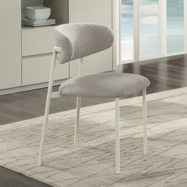 The Ingram collection brings modern elegance to your home with its sophisticated pieces. The rectangular dining table and side chairs feature a light gray finish, creating a serene dining atmosphere. The server, with its ceramic top and light gray finish,
