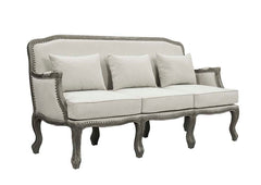 Finely crafted with superb carved details and a lovely natural finish, the Tania sofa flaunts a French cabriole silhouette that perches on graceful cabriole legs and showcases its antique-inspired profile. The nailhead trim accents give this piece a moder