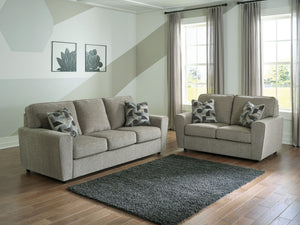 Revamp your sleekly styled living room sanctuary with this sofa and loveseat. Well-suited to contemporary spaces with a calming neutral upholstery in a pewter hue, it makes a subtle design statement in your space whether youâ€™re hosting guests or enjoyin